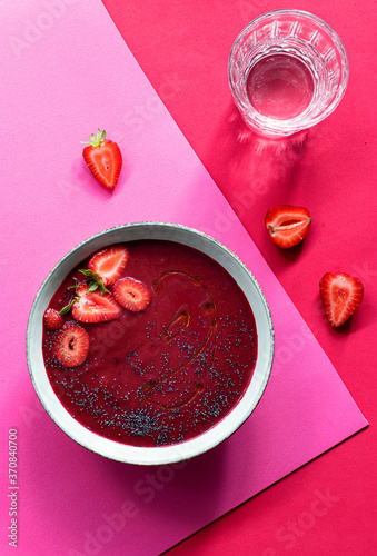Strawberry and beet gazpacho in bowl photo