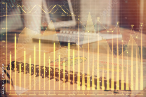 Double exposure of financial graph drawings and desk with open notebook background. Concept of forex market © peshkova