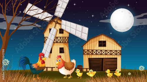 Farm scene with barn and windmill and chicken at night