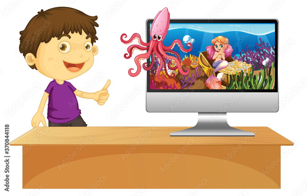 Happy boy next to computer with underwater scene on screen Happy boy next to computer with underwater scene on screen