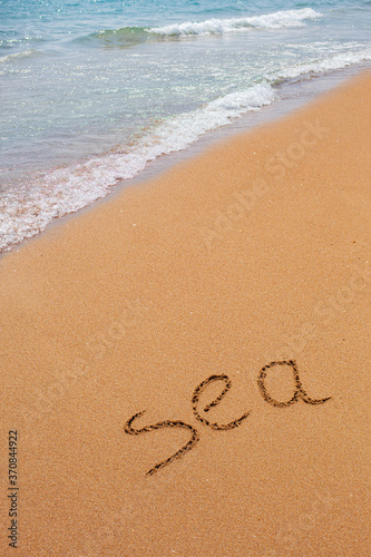 Inscription of the word Sea on the ocean. Beautiful sea landscape.