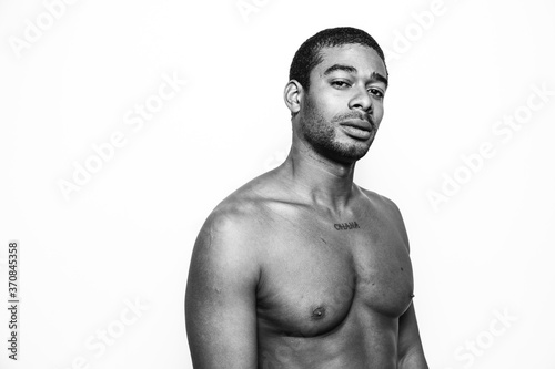 Portrait of african american man over white background and looking at camera