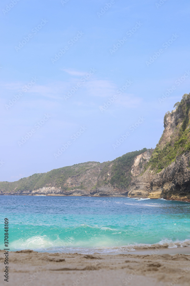Manta Bay or Kelingking Beach on Nusa Penida Island, Bali, Indonesia. Amazing  view, white sand beach with rocky mountains and azure lagoon with clear water of Indian Ocean 