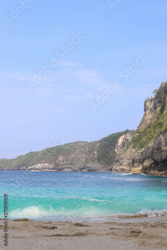 Manta Bay or Kelingking Beach on Nusa Penida Island  Bali  Indonesia. Amazing  view  white sand beach with rocky mountains and azure lagoon with clear water of Indian Ocean 