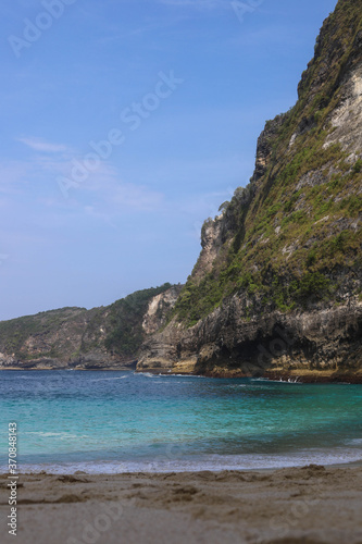 Manta Bay or Kelingking Beach on Nusa Penida Island, Bali, Indonesia. Amazing view, white sand beach with rocky mountains and azure lagoon with clear water of Indian Ocean 