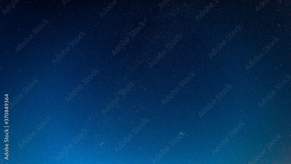 The starry night sky. A lot of stars, the Milky Way and the Andromeda galaxy.