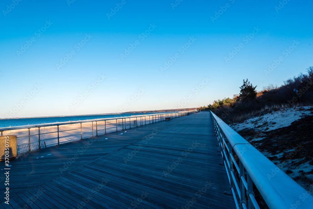 The endless boardwalk at sunken meadow state park, New York, in the winter.