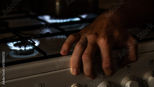 My hand on the kitchen cooker near the fire