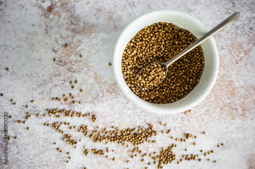 Bowl of coriander seeds photo