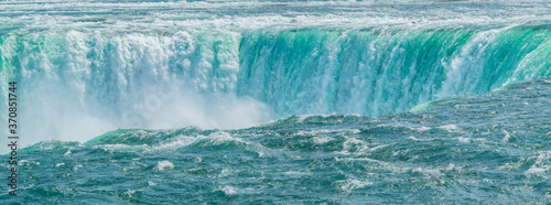Fotografiet Niagara falls closeup, as if a sinking hole in the ocean.