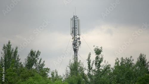 Cinematic shot: Telecommunication tower. Telecom tower antennas and satellite transmits the signals of cellular 5g 4g mobile signals to the consumers and smartphones. 4k. 24 fps