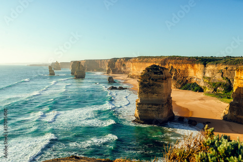 Scenic view of Twelve Apostles against clear sky during sunset, Great Ocean Road, Victoria, Australia photo