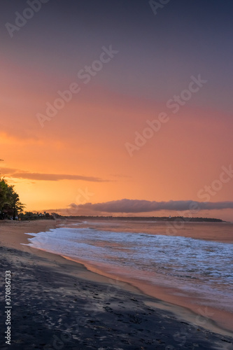 Beautiful sunset over the sea  orange sky. Arugam bay  Ceylon. portrait format