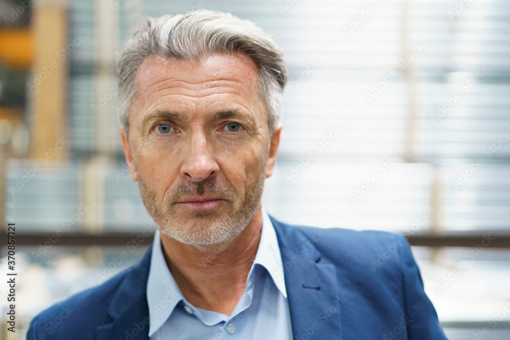 Portrait of a confident mature businessman in a factory Portrait of a confident mature businessman in a factory