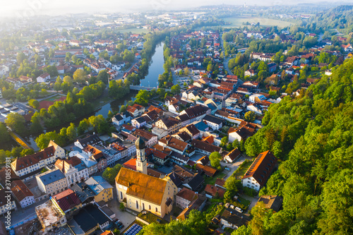 Germany, Bavaria, Wolfratshausen, Drone view of riverside town at dawn photo