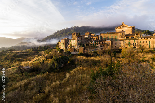 Spain, Balearic Islands, Mallorca, Valldemossa, S'Arxiduc, View to village with chartreuse, Carthusian monastery