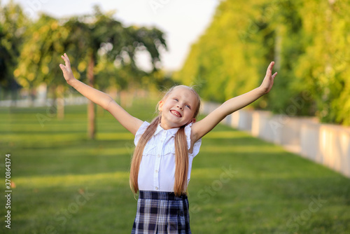 Portrait of a happy first grader schoolgirl