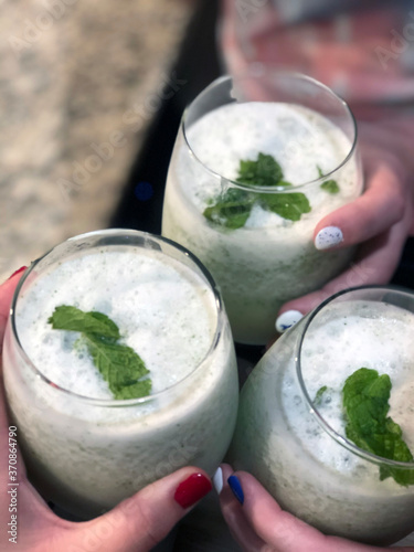 Wallpaper Mural Frozen coconut- mint mojito alcoholic drink with fresh mint toppings, cheers Torontodigital.ca