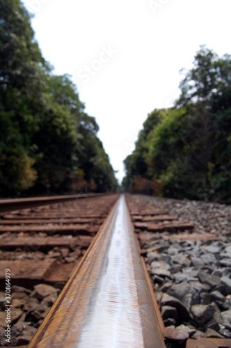 Wallpaper Mural Close-up perspective of rusty rail road track on a cloudy day Torontodigital.ca