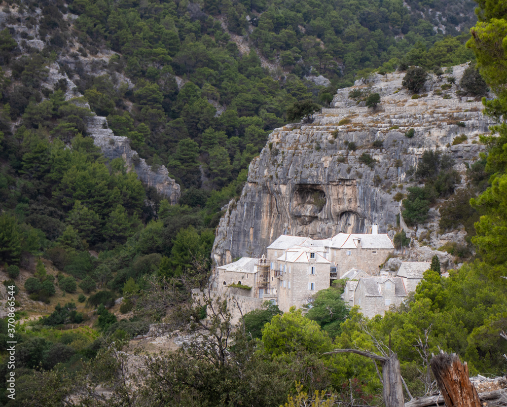 Monastery in the side of the mountain, Pustinja Blaca, deserted remote area on the island of Brac in Croatia