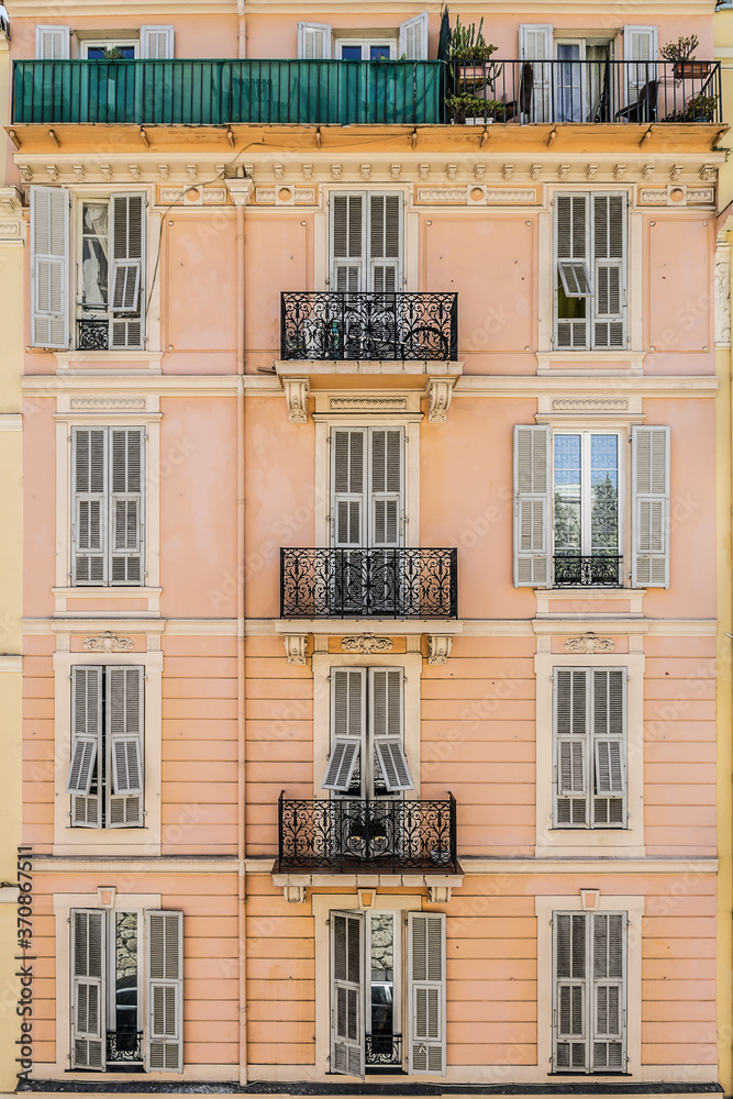 French old house with original design of balconies and windows. Nice, Cote d'Azur, France.