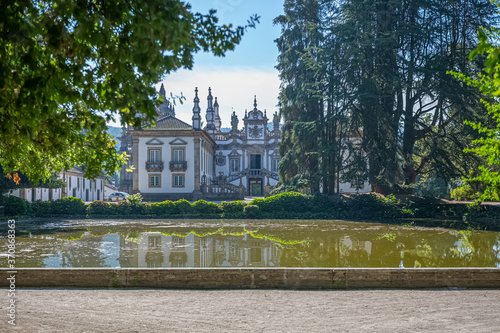 View of the Solar de Mateus exterior building, iconic of the 18th century Portuguese baroque, lake with building reflection