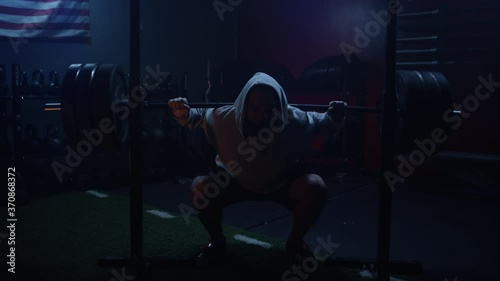Muscular Athlete Doing Barbell Squats at Home Gym During Covid-19 Pandemic