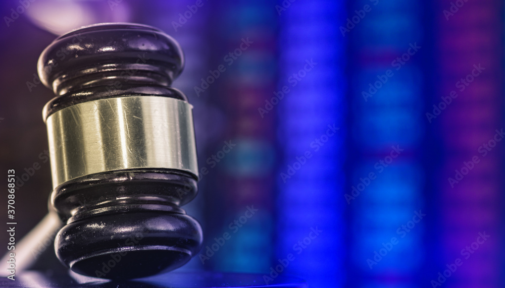 Judges gavel with glowing computer screen monitor background. Judges gavel with glowing computer screen monitor background.