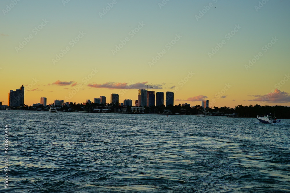 Miami downtown skyscrapers and beach at sun set	
