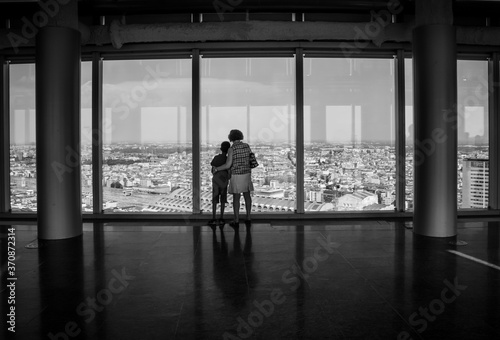  People admiring the Milan skyline from the 43-storey of the modern glass Lombardy Building (Palazzo Lombardia), a 161 m tall skyscraper