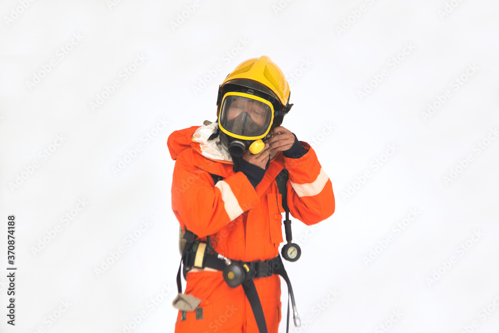 The portrait of Asian firefighters are wearing orange fire protection uniform mask and helmet on white background.