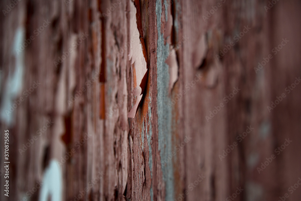 Old deteriorating wall with peeling red paint Old deteriorating wall with peeling red paint