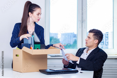 Woman puts things in a box....