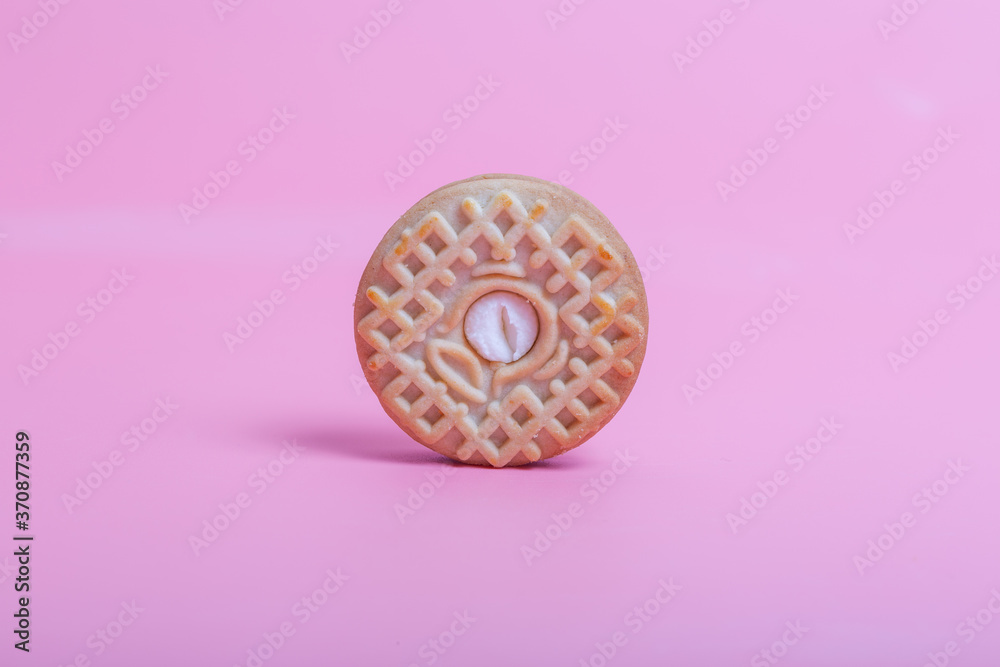 Cream sandwich biscuits on pink background Cream sandwich biscuits on pink background