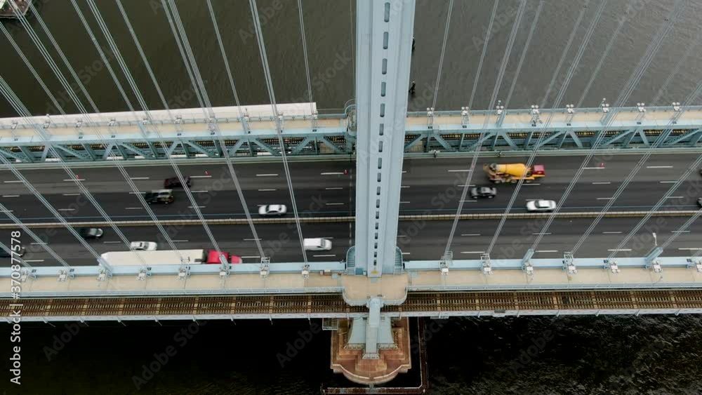 Static aerial shot of traffic on Ben Franklin Bridge in Philadelphia, transportation, commute concept, bridge girder bisects view Static aerial shot of traffic on Ben Franklin Bridge in Philadelphia, transportation, commute concept, bridge girder bisects view