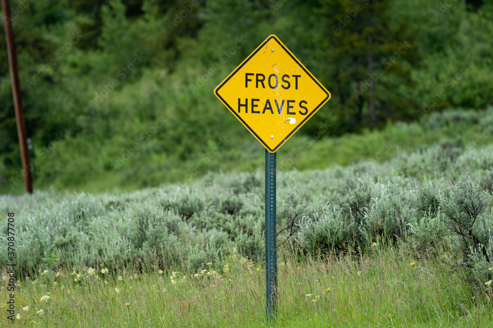 Sign warning drivers of frost heaves in the road
