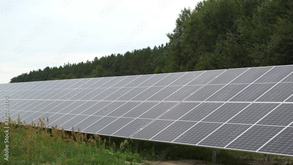 A solar panel station installed in a field to collect solar energy and convert it into electricity. Environmentally friendly electrical energy. A solar panel station installed in a field to collect solar energy and convert it into electricity. Environmentally friendly electrical energy.