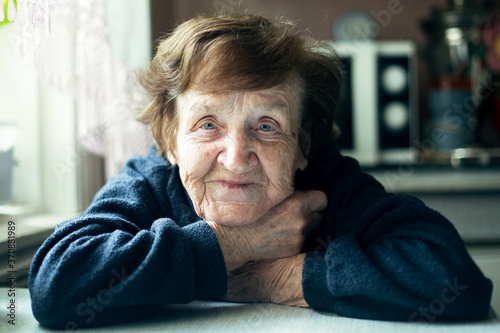 Close-up portrait of an Old woman in her home.