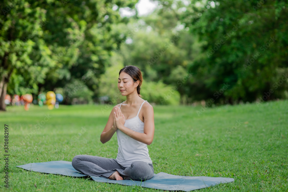 Healthy women doing yoga in the moring at the park . concept healthy and outdoor activity. Healthy women doing yoga in the moring at the park . concept healthy and outdoor activity.