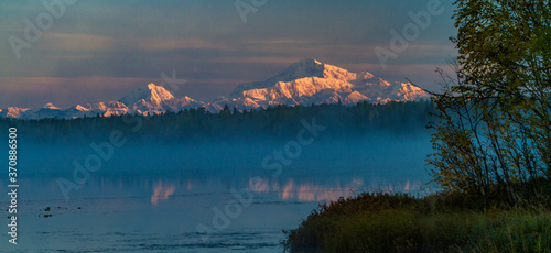 Denali and Mt Hunter reflected in Kashwitna Lake, south of Talkeetna, Alaska.