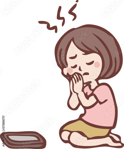 当選をスマートフォンに願う女性