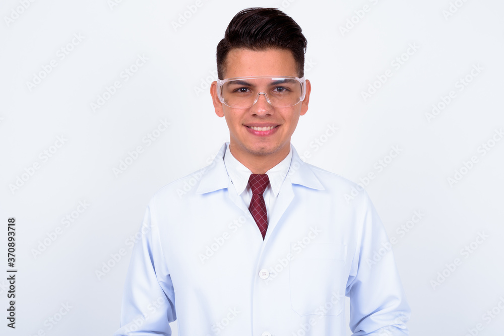 Happy young handsome multi ethnic man doctor as scientist with protective glasses Happy young handsome multi ethnic man doctor as scientist with protective glasses