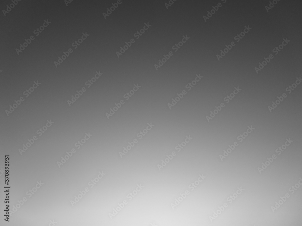 Obraz premium Abstract gray background with light. Black and white background.