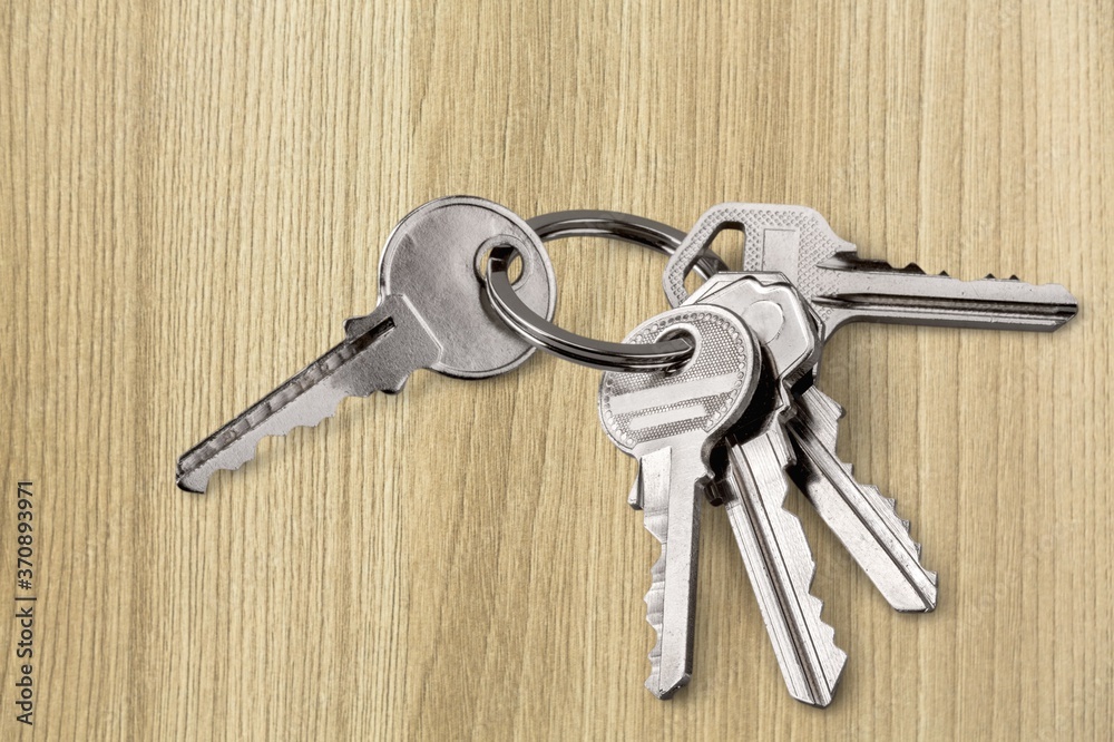 Classic metal keys on keyring on the desk Classic metal keys on keyring on the desk
