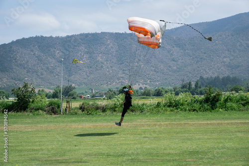 Melipilla, Chile. October, 23, 2020: skydiver landing after parachuting in Chile photo