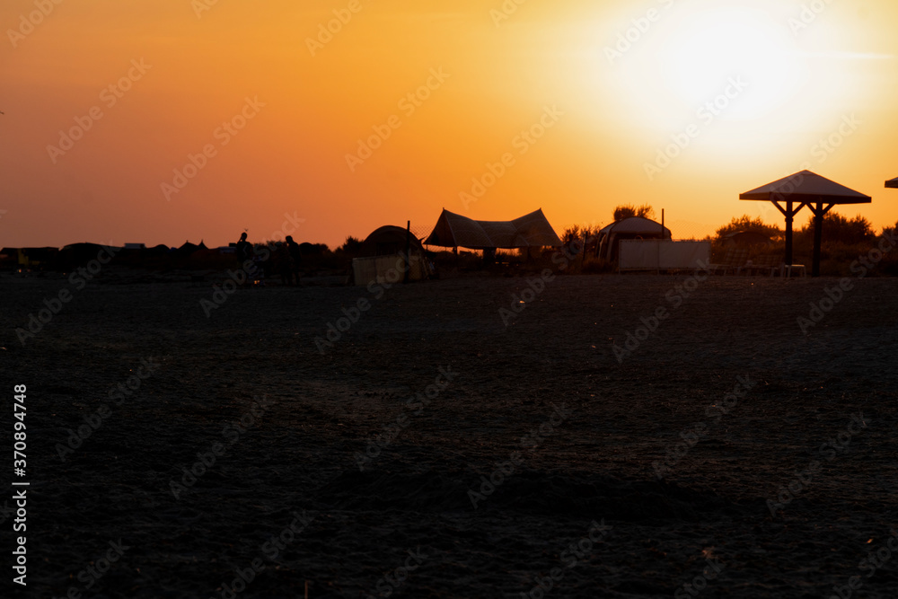 Beautiful orange sunset by the sea, summer beach day. Beautiful nature. Beautiful orange sunset by the sea, summer beach day. Beautiful nature.