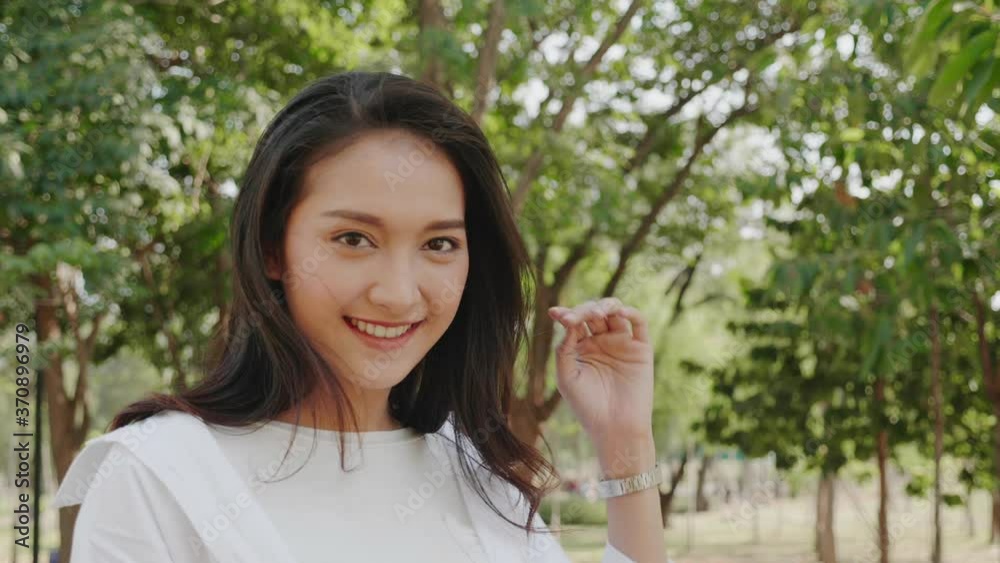 Authentic close up Happy smiling pretty asian woman. Enjoy nature in park for summer. Beauty black hair. End of quarantine and return to Travel around the world Authentic close up Happy smiling pretty asian woman. Enjoy nature in park for summer. Beauty black hair. End of quarantine and return to Travel around the world