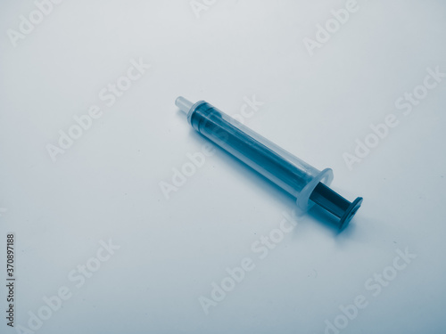 syringe on blue background