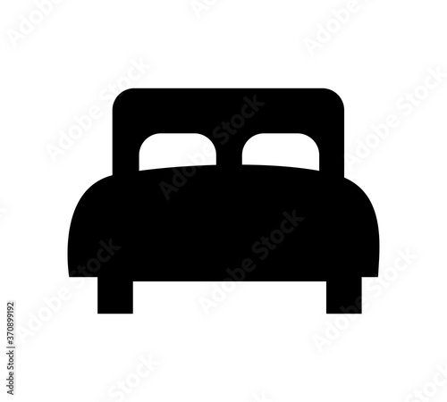 Bed with pillows simple black vector icon. Hotel or hostel symbol.