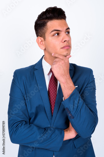 Portrait of young handsome multi ethnic businessman in suit